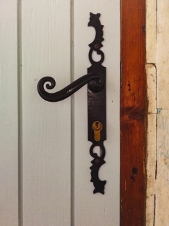 Old door handle restored to its former glory